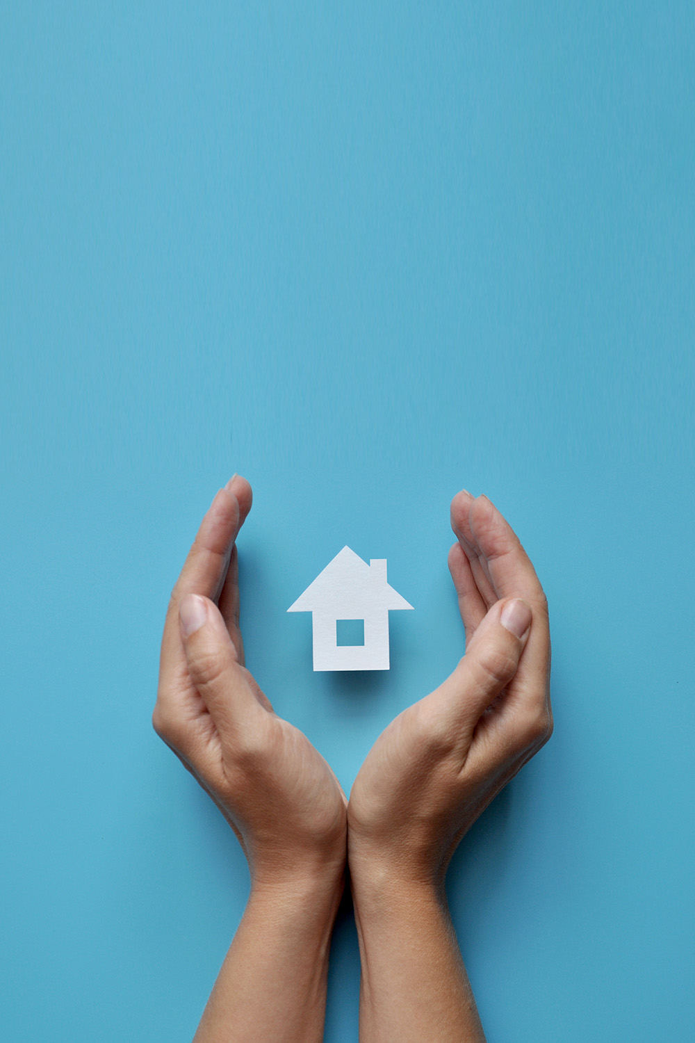 Hands around a house symbol behind a blue background, symboling Op FORTITUDE needs assessment.