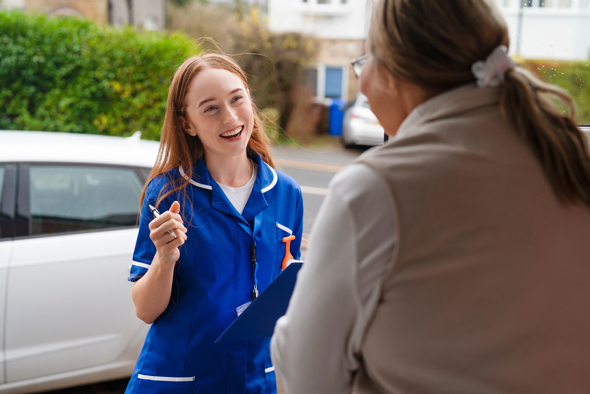 A health assessment worker visiting the home of a carer, highlighting help for carers in Scotland.