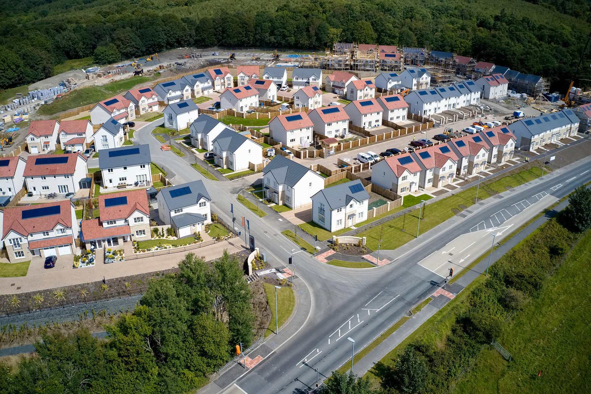 Aerial view of new-build homes in Scotland, showing how veterans can help help with buying a new-build home.