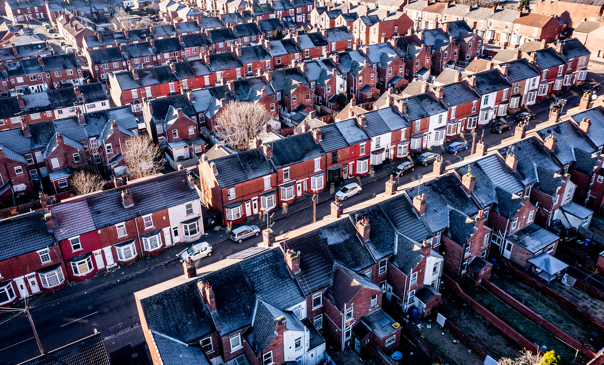 Terraced street of houses demonstrating renting a home in England.