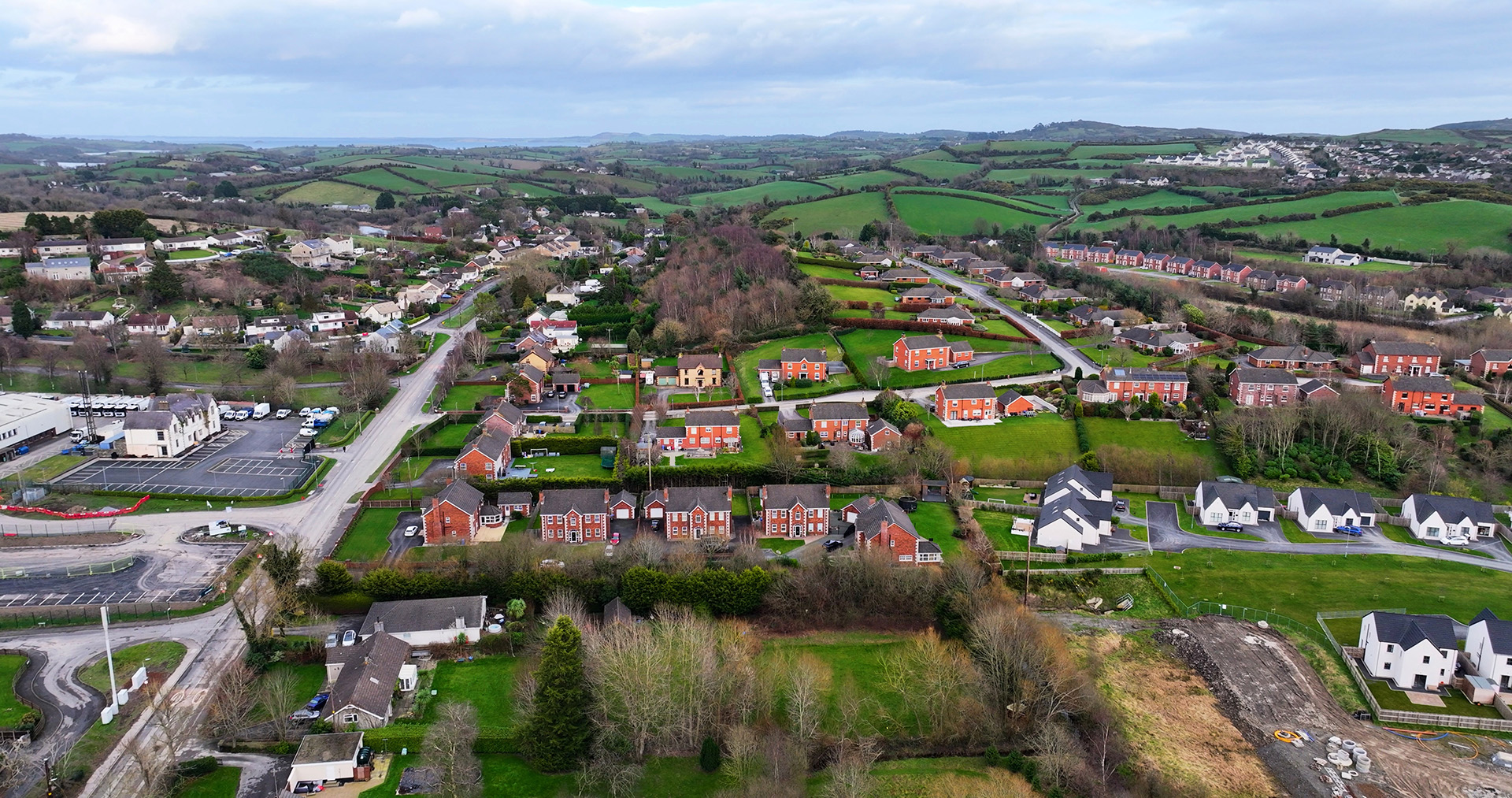 Aerial view of residential housing in Downpatrick County Down, showing how veterans can get help with buying a home in Northern Ireland through the FairShare scheme.