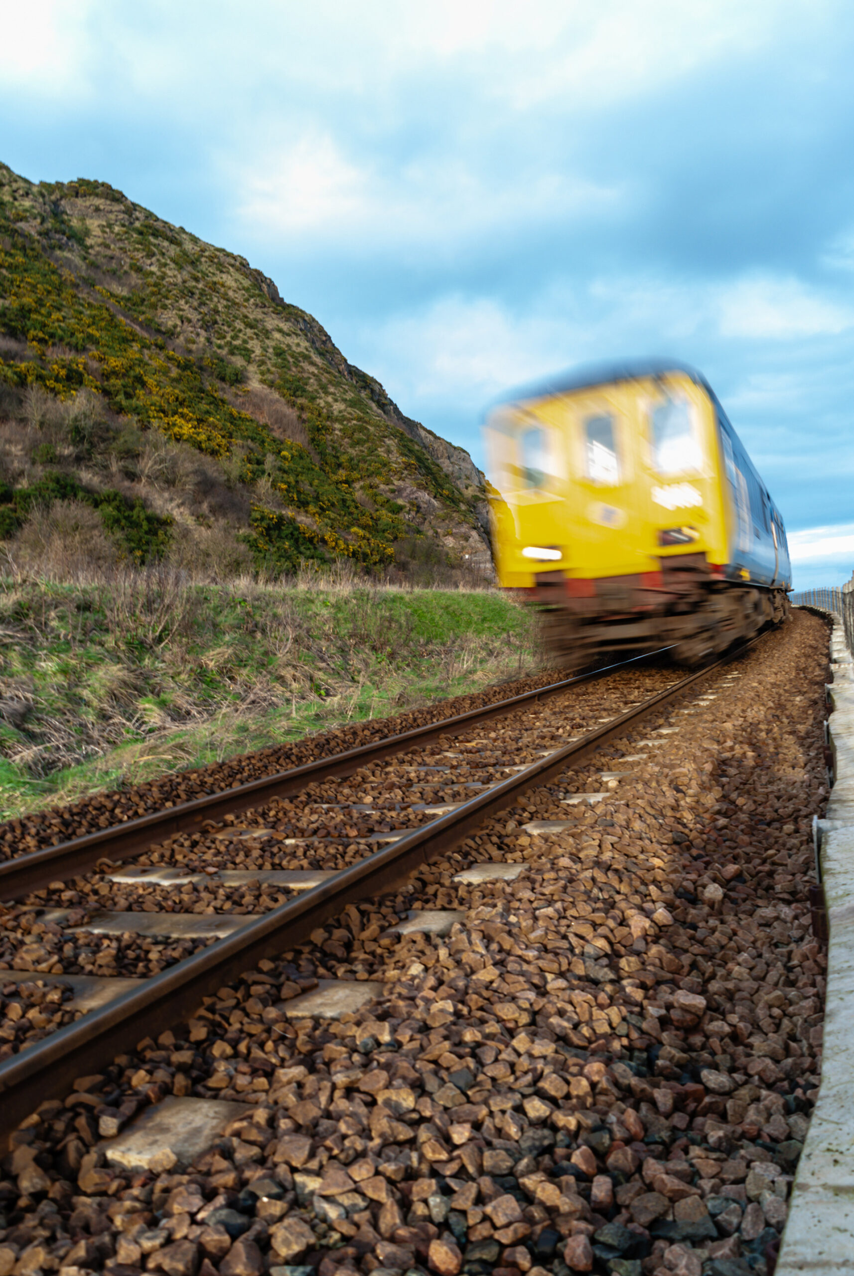 A train travelling on a track, showing armed forces discounts for veterans when travelling by rail in Northern Ireland.